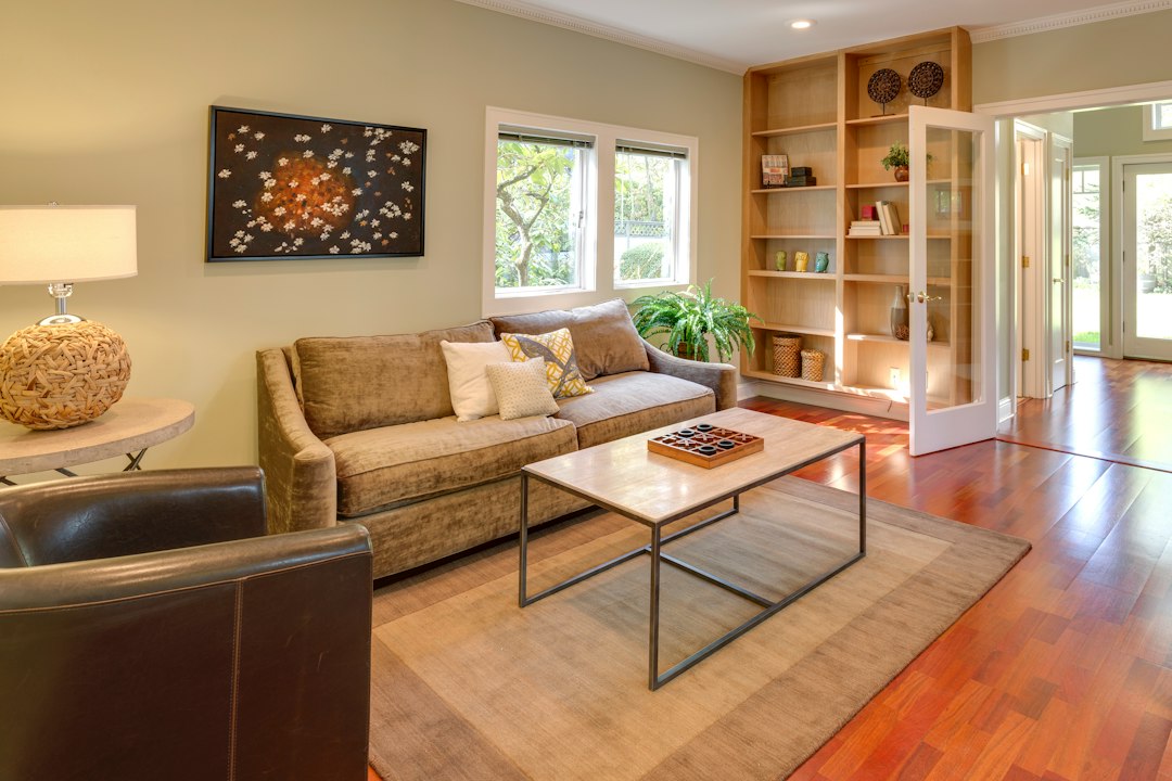 Living room with a sofa, wooden coffee table, and built-in bookshelves.