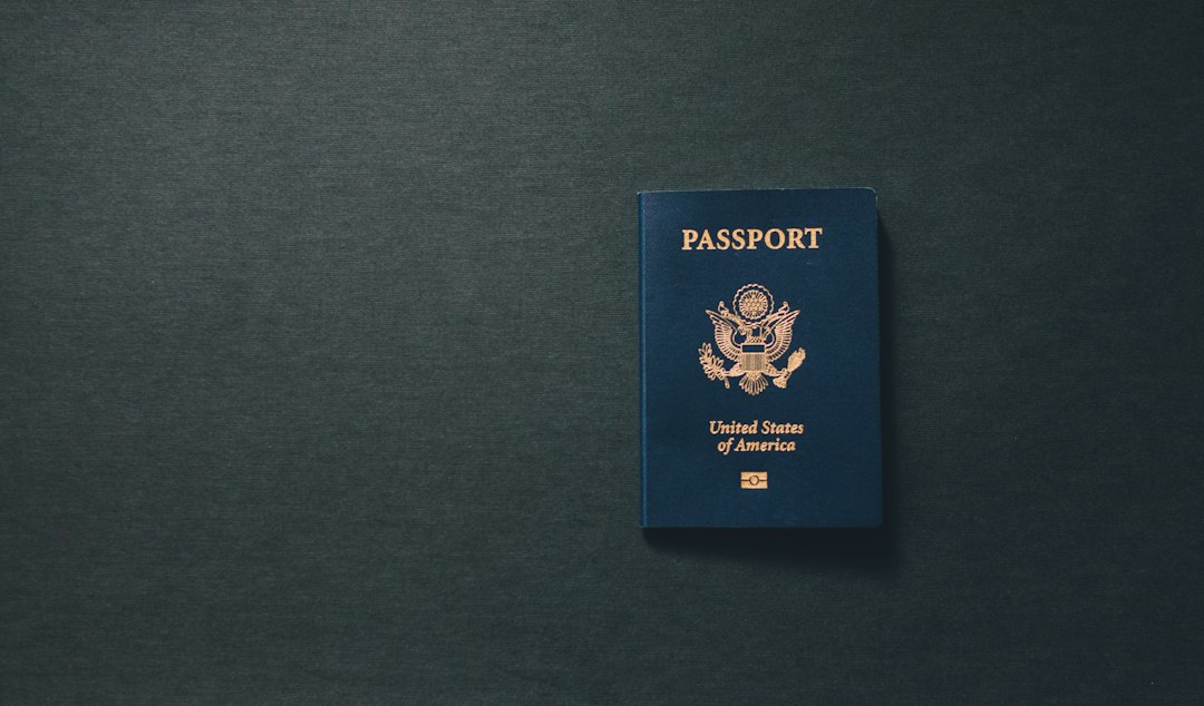 Closed United States passport on a dark surface