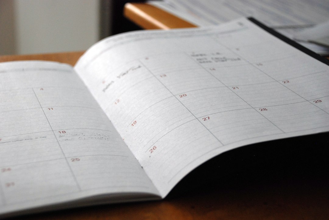 Open paper calendar with a monthly grid