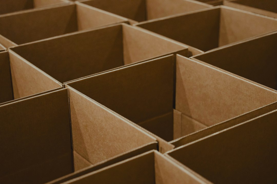 Open corrugated cardboard boxes arranged in rows